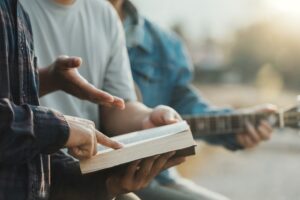 Religious or spiritual group study session outside, focusing on faith-based recovery, support, and healing at Firm Foundation Treatment Center.