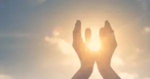 Hands reaching towards the sunlight symbolizing hope and recovery at a trusted addiction treatment center.