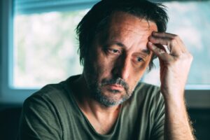 Sad man asking himself Can You Get Disability For Depression.