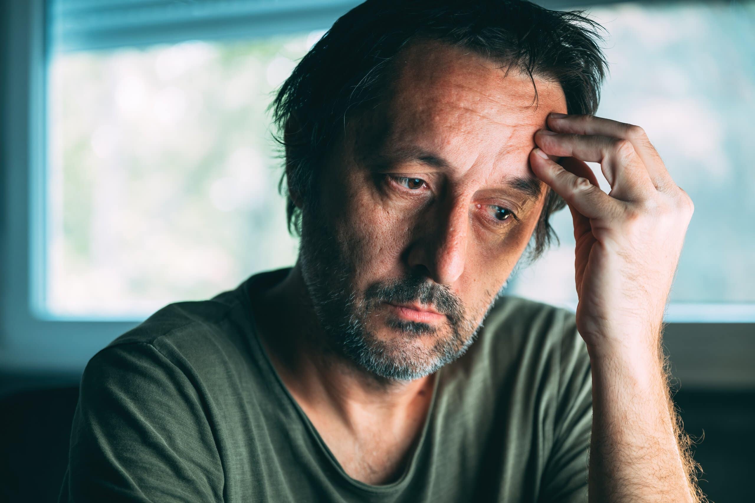 Sad man asking himself Can You Get Disability For Depression.