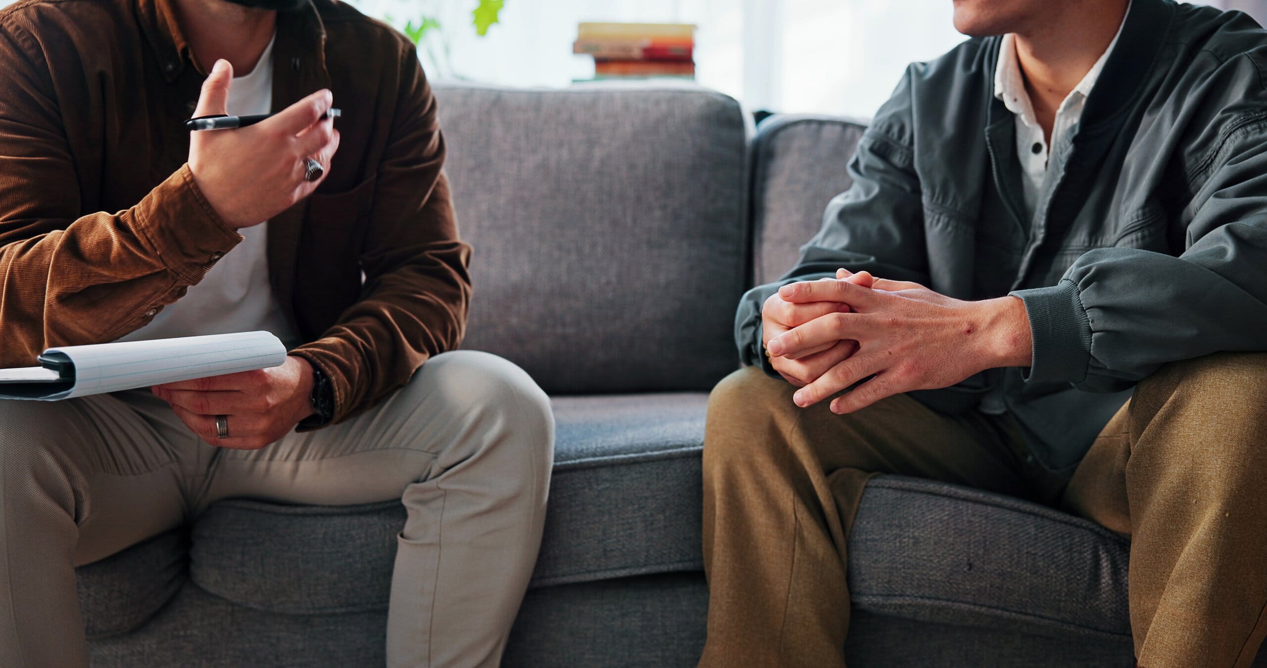 Two men talking about what are the 12 steps of addiction recovery​.